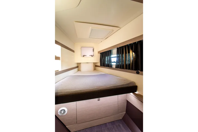 Bodhi Quest Yacht Photos Pics 2023 Fountaine Pajot Isla 40 cabin interior with bed and window.