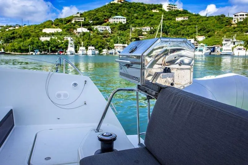 Bodhi Quest Yacht Photos Pics 2023 Fountaine Pajot Isla 40 yacht with grill, docked in scenic marina.