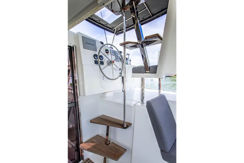 Bodhi Quest Yacht Photos Pics Helm station of 2023 Fountaine Pajot Isla 40 catamaran with modern navigation equipment.