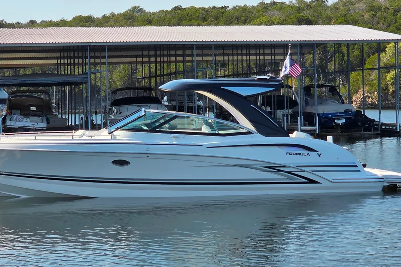  Yacht Photos Pics 2026 Formula 350 Crossover Bowrider I/O docked at marina, sleek design, calm water.