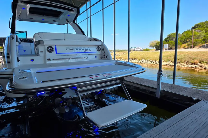  Yacht Photos Pics 2026 Formula 350 Crossover Bowrider I/O docked, showcasing sleek design and modern features.
