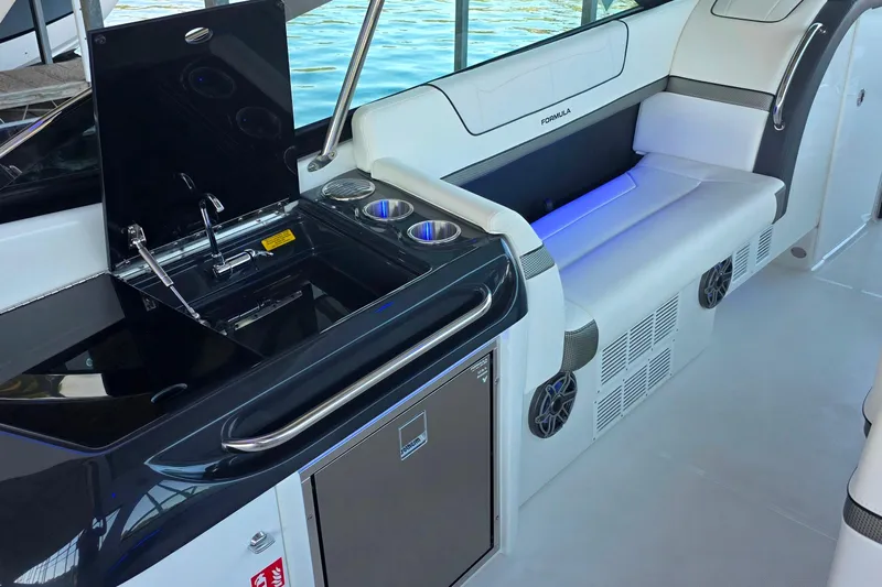  Yacht Photos Pics 2026 Formula 350 Crossover Bowrider I/O interior with sleek seating and modern kitchenette.