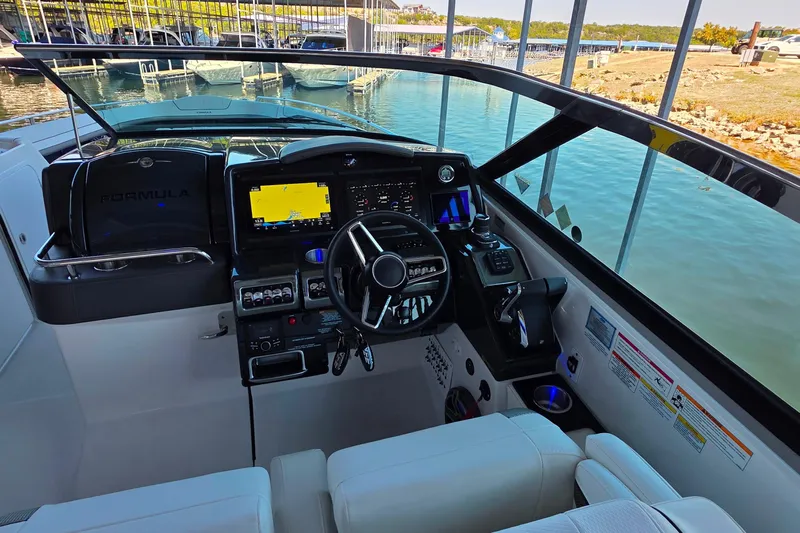  Yacht Photos Pics 2026 Formula 350 Crossover Bowrider I/O cockpit with modern navigation system and controls.