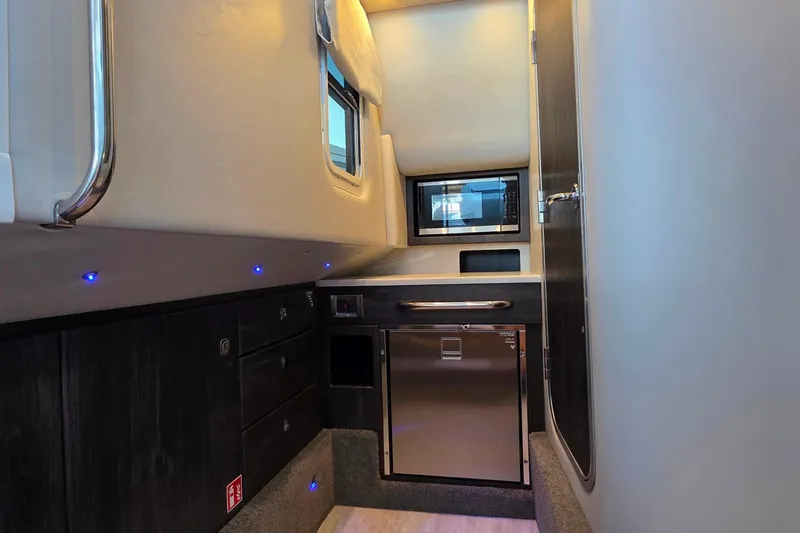  Yacht Photos Pics Interior of 2026 Formula 350 Crossover Bowrider I/O, featuring modern kitchenette and sleek design.