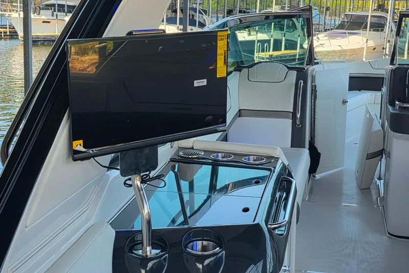  Yacht Photos Pics 2026 Formula 350 Crossover Bowrider I/O interior with TV and seating area.