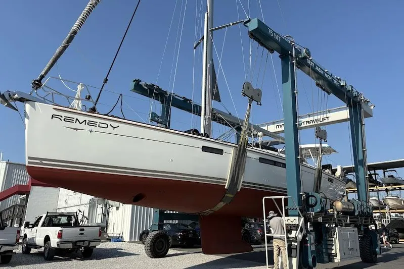 Remedy Yacht Photos Pics 2012 Jeanneau 57 sailboat "Remedy" lifted by a travel lift in a boatyard.