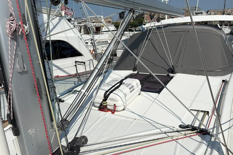 Remedy Yacht Photos Pics 2012 Jeanneau 57 sailboat deck with rigging and covered cockpit in marina.