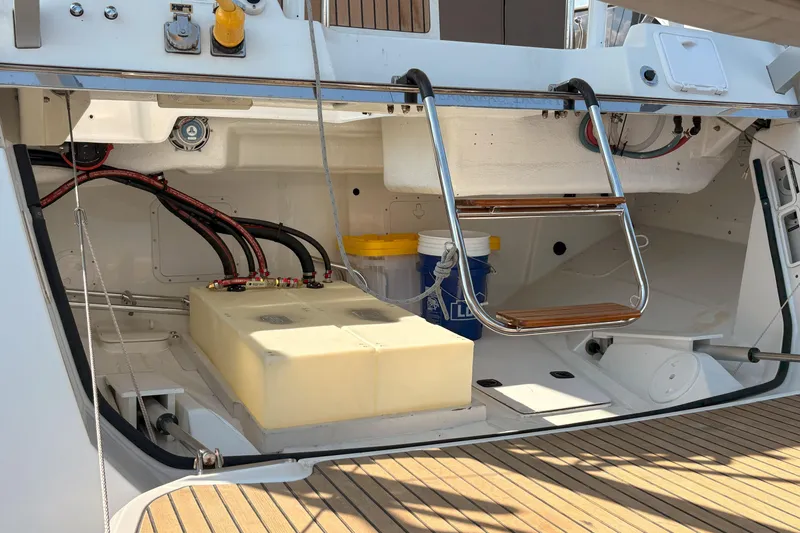 Remedy Yacht Photos Pics 2012 Jeanneau 57 yacht stern with storage compartment and ladder.
