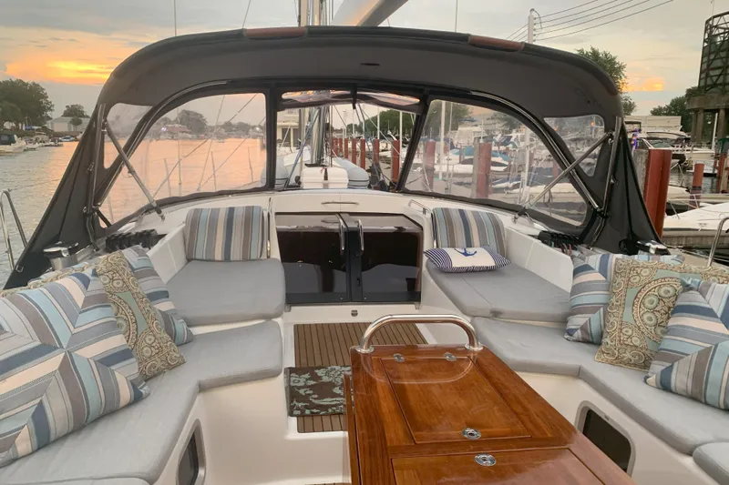Remedy Yacht Photos Pics Luxurious 2012 Jeanneau 57 yacht interior with elegant seating and sunset view.