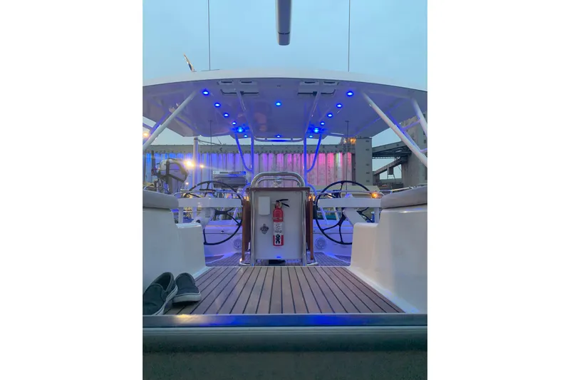 Remedy Yacht Photos Pics 2012 Jeanneau 57 yacht cockpit with blue LED lights and dual steering wheels.