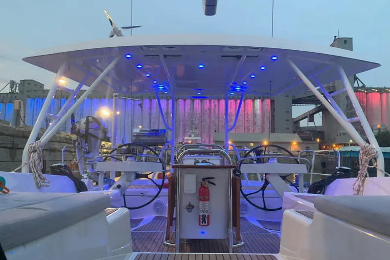 Remedy Yacht Photos Pics 2012 Jeanneau 57 yacht deck with blue LED lights and dual steering wheels.