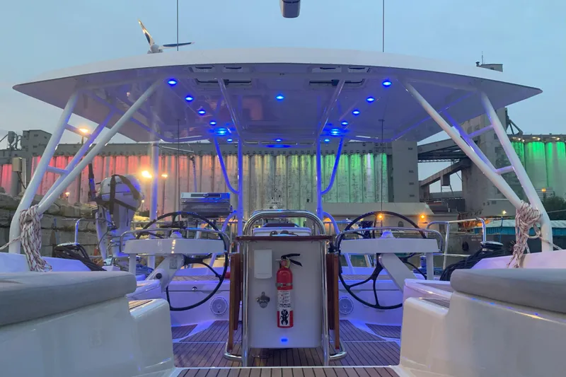 Remedy Yacht Photos Pics Jeanneau 57 yacht cockpit with blue LED lights, 2012 model, docked at industrial port.
