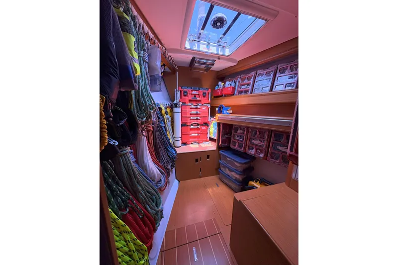 Remedy Yacht Photos Pics Organized storage room on 2012 Jeanneau 57 yacht with ropes and toolboxes.