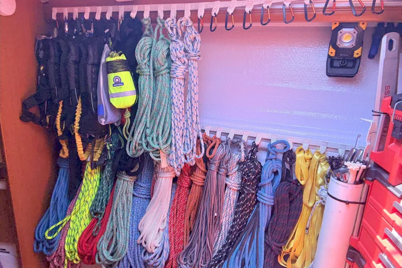 Remedy Yacht Photos Pics Organized ropes and gear storage on a 2012 Jeanneau 57 sailboat.