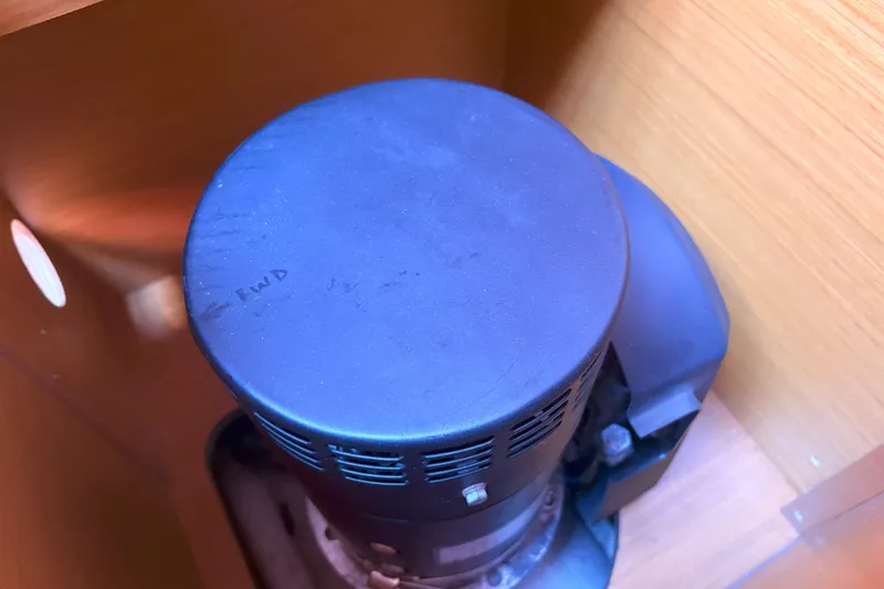 Remedy Yacht Photos Pics Engine component inside a 2012 Jeanneau 57 yacht, featuring a black circular cover.