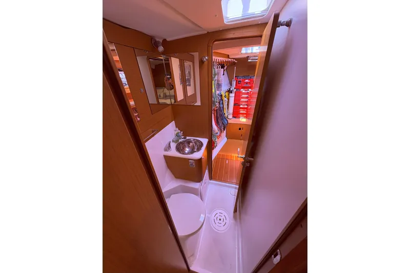 Remedy Yacht Photos Pics Interior of 2012 Jeanneau 57 yacht bathroom with sink and storage.