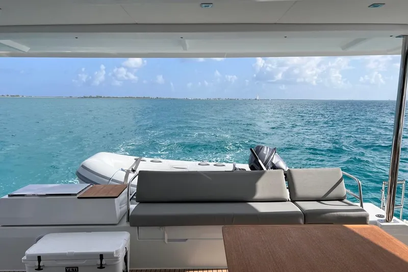 Endless Summer Yacht Photos Pics Fountaine Pajot Aura 51 Catamaran 2022, ocean view from deck with seating and tender.