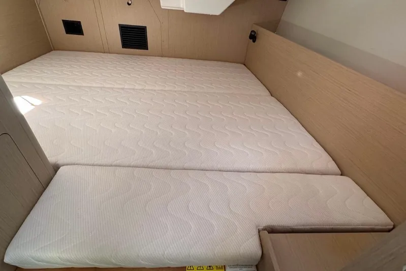 At Last Yacht Photos Pics 2023 Beneteau Oceanis 38.1 cabin interior with comfortable mattress and modern design.