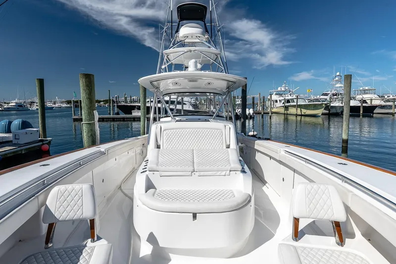  Yacht Photos Pics 2023 Valhalla Boatworks V-46 luxury yacht docked at marina under clear blue sky.