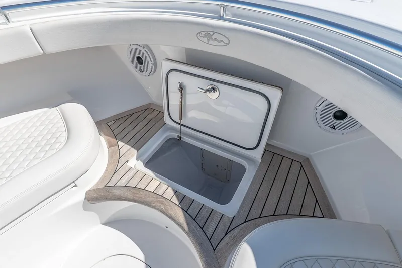  Yacht Photos Pics 2023 Valhalla Boatworks V-46 interior with storage compartment and cushioned seating.