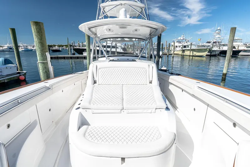  Yacht Photos Pics 2023 Valhalla Boatworks V-46 luxury yacht docked at marina under clear blue sky.