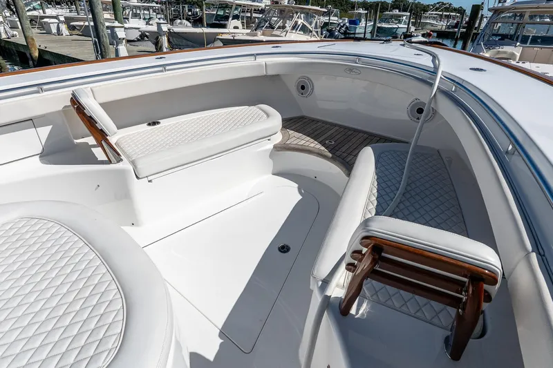  Yacht Photos Pics Luxurious 2023 Valhalla Boatworks V-46 interior with white cushioned seating and elegant design.