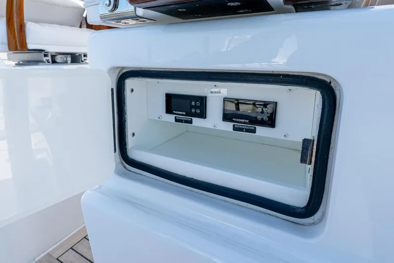  Yacht Photos Pics 2023 Valhalla V-46 boat refrigeration compartment with control panel.