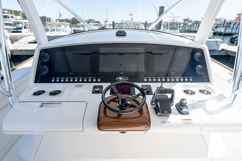  Yacht Photos Pics 2023 Valhalla Boatworks V-46 helm with advanced navigation controls and sleek design.