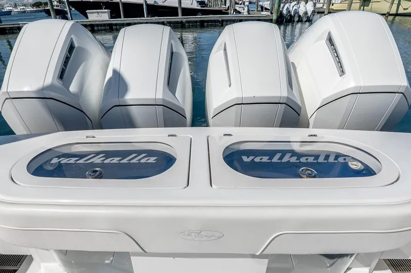  Yacht Photos Pics 2023 Valhalla Boatworks V-46 with four powerful outboard engines at the dock.