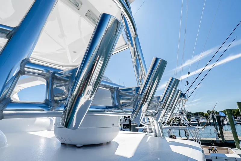  Yacht Photos Pics 2023 Valhalla Boatworks V-46 with polished metal details under clear blue sky.