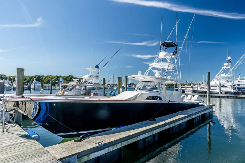  Yacht Photos Pics 2023 Valhalla Boatworks V-46 docked at a marina under clear blue skies.