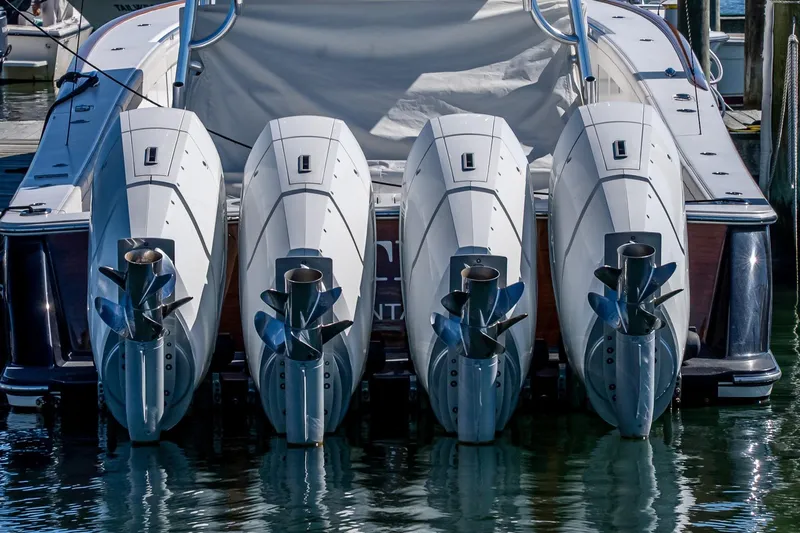  Yacht Photos Pics 2023 Valhalla Boatworks V-46 with four powerful outboard engines at dock.