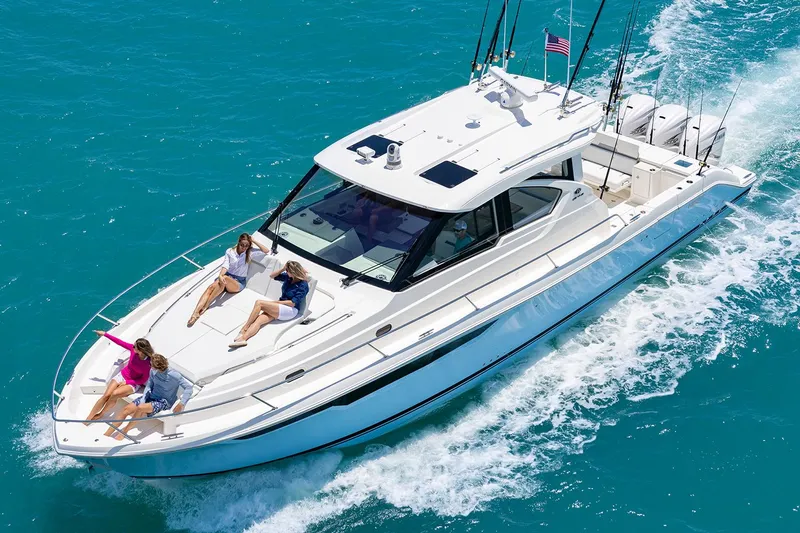  Yacht Photos Pics Manufacturer Provided Image: 2024 Pursuit OS 445 Offshore cruising with passengers on deck.