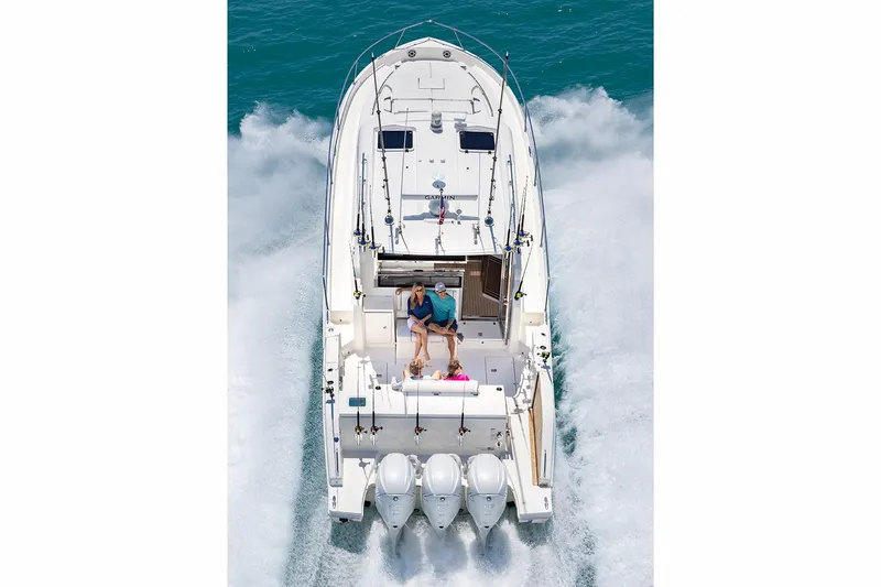  Yacht Photos Pics Manufacturer Provided Image: 2024 Pursuit OS 445 Offshore boat cruising on water, aerial view.