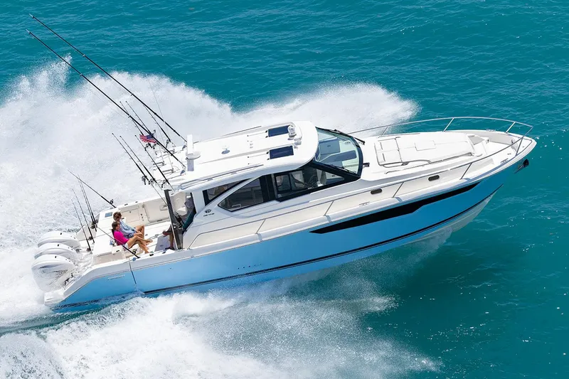  Yacht Photos Pics Manufacturer Provided Image: 2024 Pursuit OS 445 Offshore boat cruising on blue ocean water.