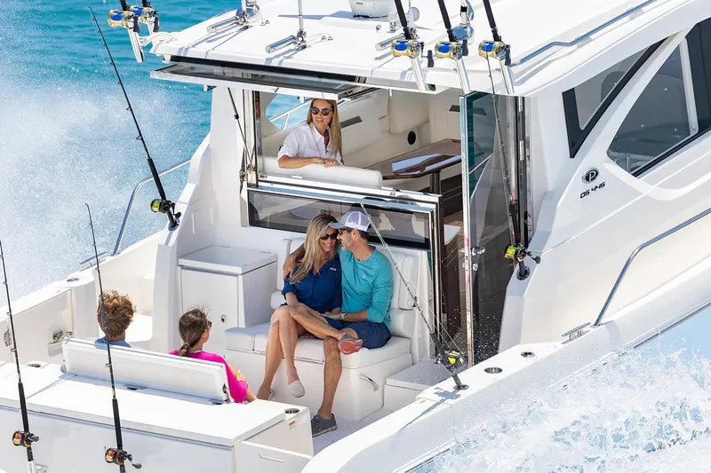  Yacht Photos Pics Manufacturer Provided Image: 2024 Pursuit OS 445 Offshore boat with people enjoying a day on the water.