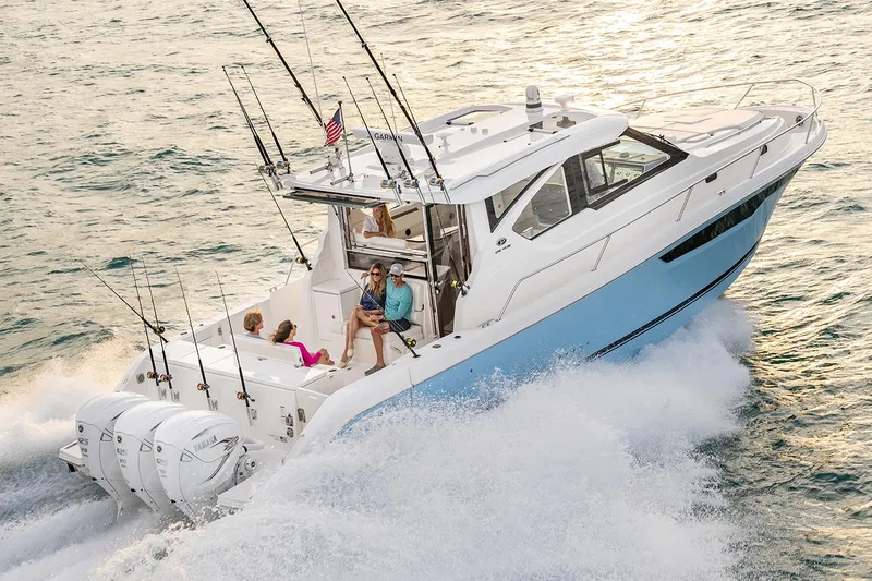  Yacht Photos Pics Manufacturer Provided Image: 2024 Pursuit OS 445 Offshore boat cruising with family on board.