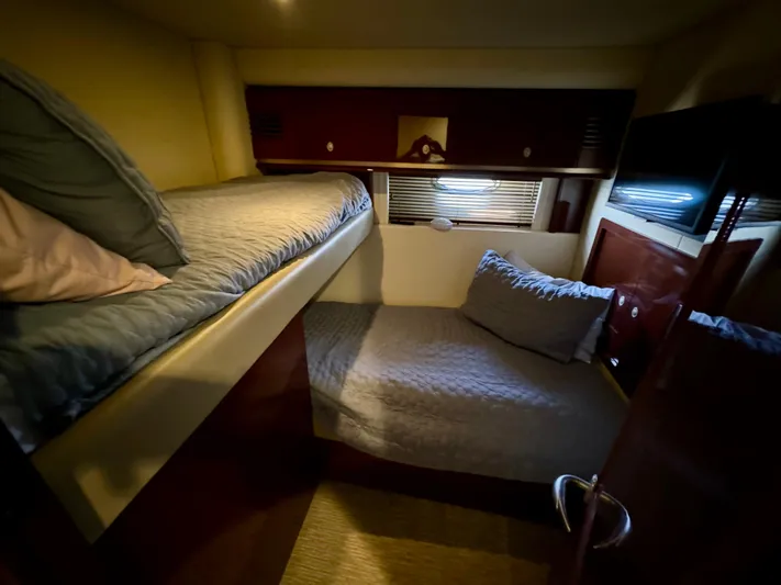 Club Life Yacht Photos Pics Cozy cabin with bunk beds in 2008 Sea Ray 58 Sedan Bridge yacht.