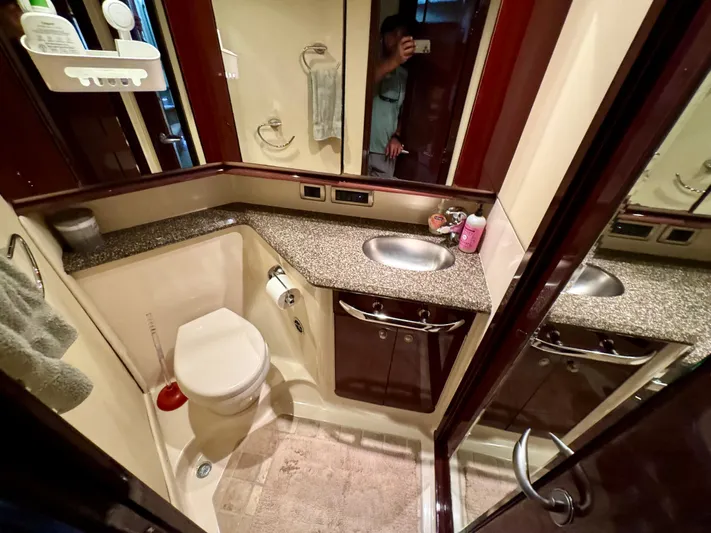 Club Life Yacht Photos Pics Luxurious bathroom in 2008 Sea Ray 58 Sedan Bridge yacht with modern amenities.