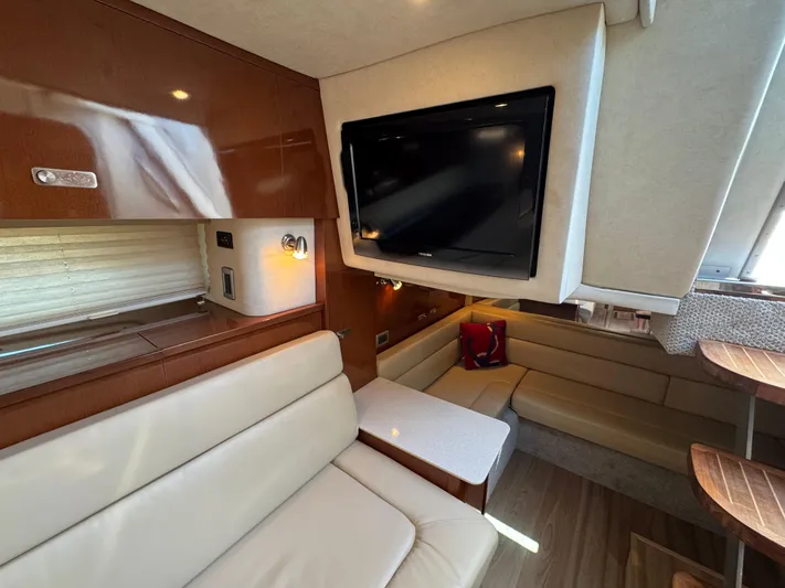  Yacht Photos Pics Interior of 2010 Sea Ray 370 Sundancer with leather seating and mounted TV.