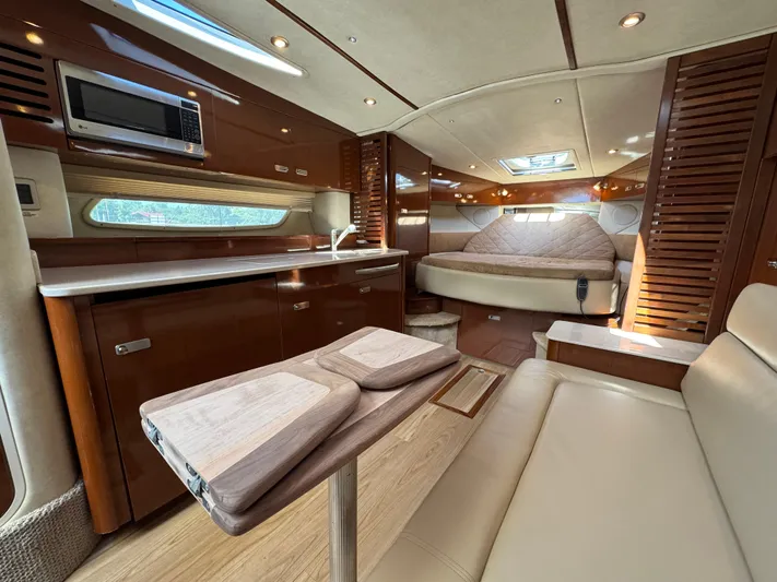  Yacht Photos Pics Luxurious interior of 2010 Sea Ray 370 Sundancer yacht with modern amenities and elegant design.