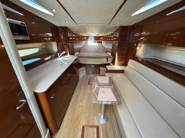  Yacht Photos Pics Luxurious interior of 2010 Sea Ray 370 Sundancer yacht with modern amenities and elegant design.