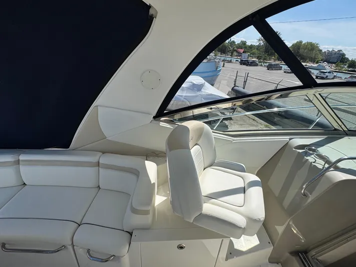  Yacht Photos Pics Interior of 2010 Sea Ray 370 Sundancer yacht with white seating and helm station.