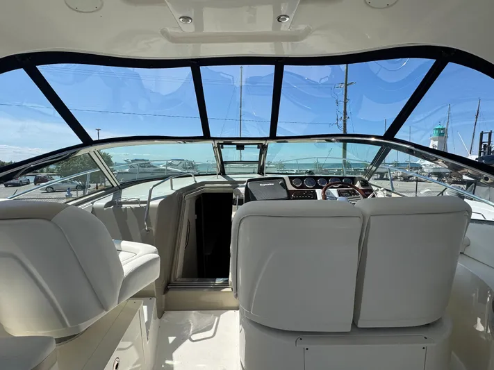  Yacht Photos Pics Interior view of 2010 Sea Ray 370 Sundancer yacht cockpit with modern controls.