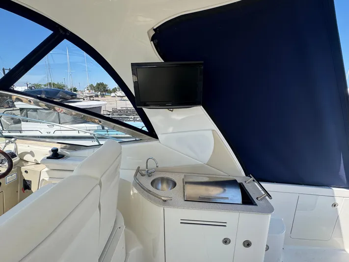  Yacht Photos Pics Interior of 2010 Sea Ray 370 Sundancer with sink, grill, and TV.