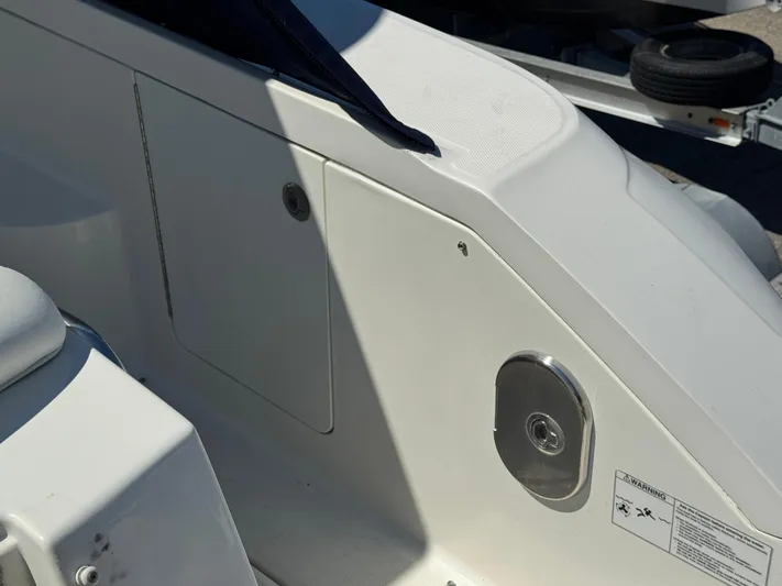  Yacht Photos Pics Close-up of a 2010 Sea Ray 370 Sundancer boat's deck area with storage compartment.