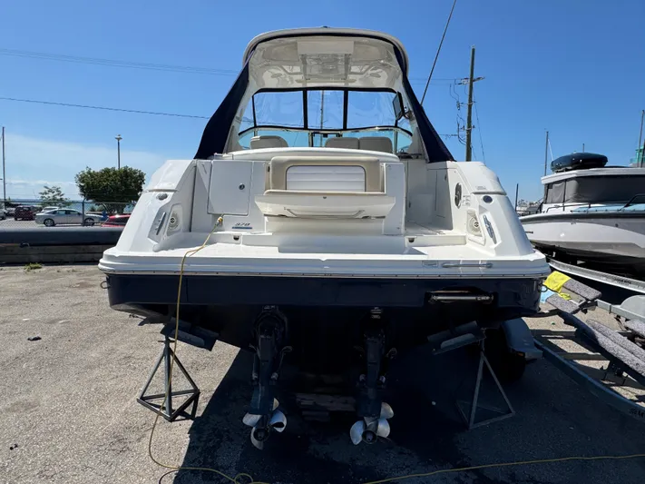  Yacht Photos Pics 2010 Sea Ray 370 Sundancer boat on dry dock, rear view, sunny day.