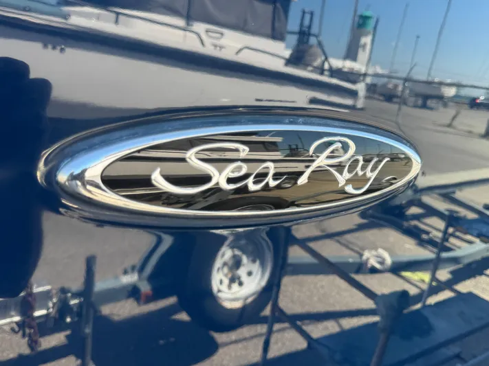  Yacht Photos Pics Sea Ray 370 Sundancer 2010 logo on a shiny boat surface.