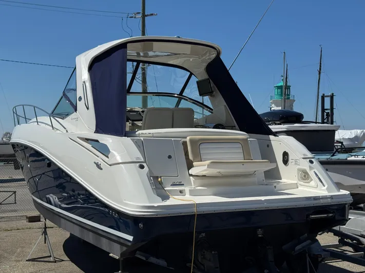  Yacht Photos Pics 2010 Sea Ray 370 Sundancer yacht docked, showcasing sleek design and spacious deck.