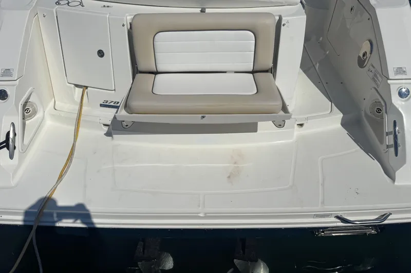 Yacht Photos Pics 2010 Sea Ray 370 Sundancer boat deck with seating and storage compartments.